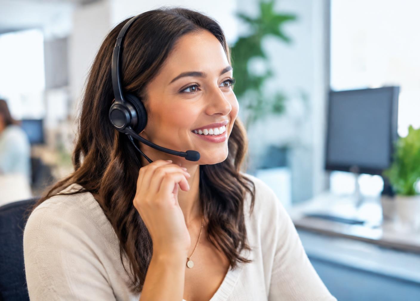 Friendly Bizfund support representative on a call wearing a headset